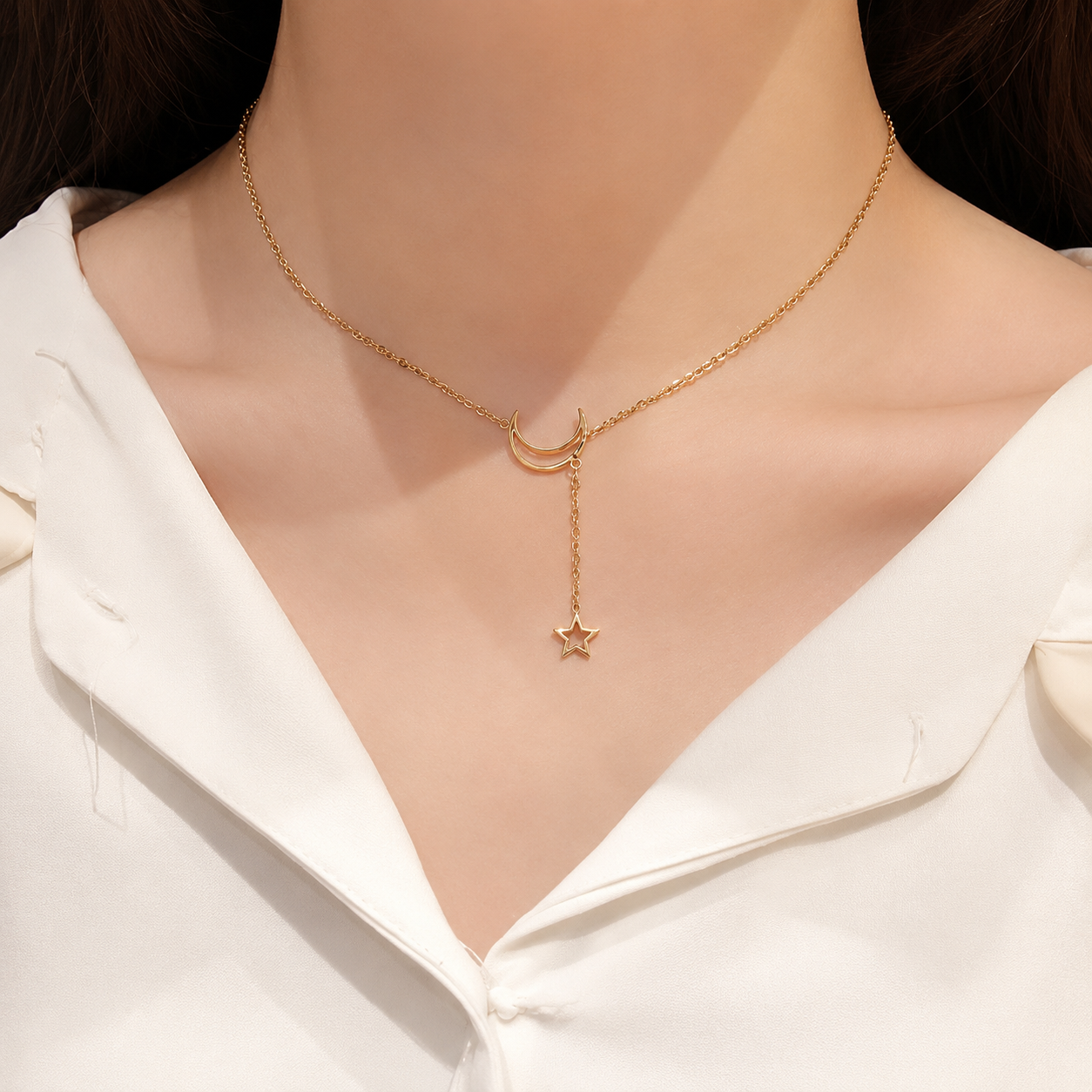Gold celestial lariat necklace styled with a white silk blouse